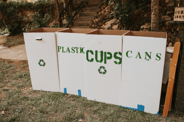 Labeled bins make recycling easy for wedding guests. Photo by Gwendolyn Meador.