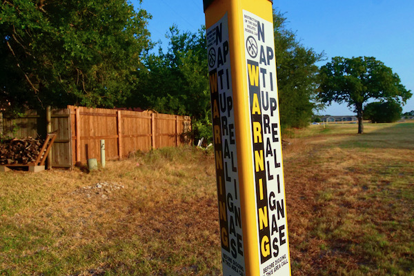 An underground gas pipeline winds past homes next to the Bruder site. Photo by J.G. Domke.