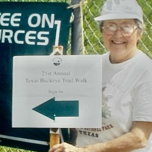 Genie Fritz holds a Texas buckeye walk sign in the 1980s. Courtesy of David Gray. 