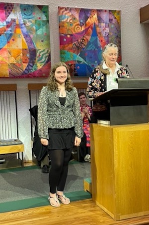 Heather van Waasbergen is honored at a ceremony conducted by Nancy Bateman, right, in July. Photo courtesy of First UU of Dallas.