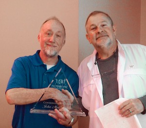 John MacFarlane accepts the Conservation Activist Award from GSDFW Director Wendel Withrow. Photo by J.G. Domke.