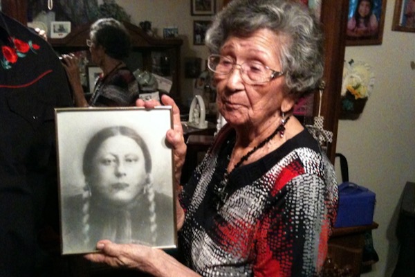 Lance Tahmahkera's Aunt with photo of Great Grandfather Tahmahkera