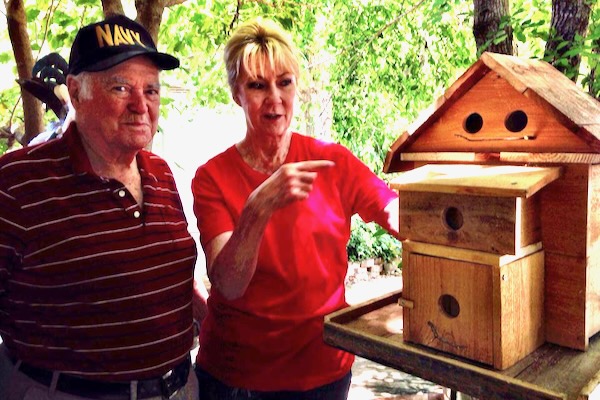 The reporter's father Phil McEwan delivers birdhouses to Kathy Rogers at Rogers Wildlife Rehabilitation Center. Photo by Andrea Ridout.