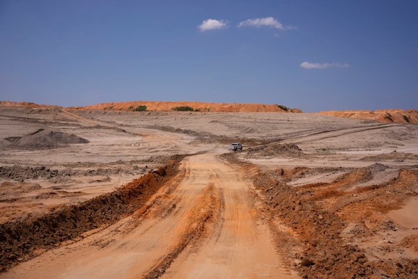 A truck drives on a dirt road that winds through a section of the NRG Jewett Mine that is undergoing environmental reclamation. Photo by Joe Timmerman, The Texas Tribune.