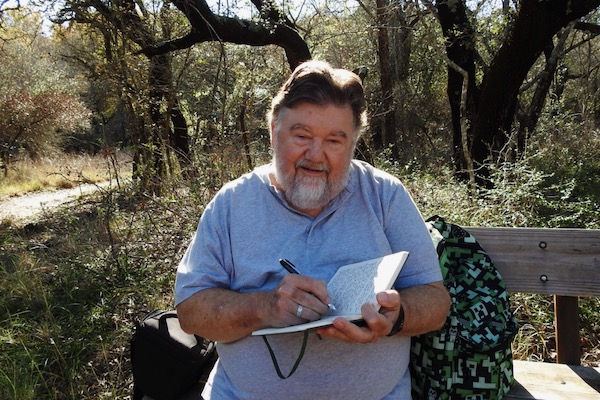 Author Michael Smith jotting notes at the Fort Worth Nature Center and Refuge. Courtesy of Michael Smith.