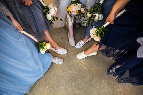 The bride and bridesmaids all wore shoes by Toms. Photo by Marjorie Lombard.
