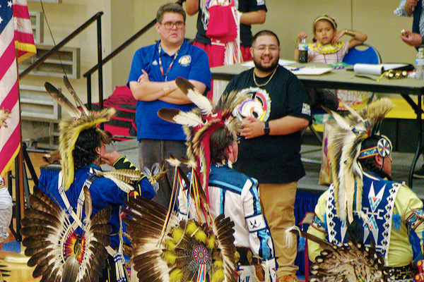 Faculty advisor Dr. Les Riding-In and NASA president Sampson Dewey watch judging for Fancy dance. Photo by J.G. Domke. 