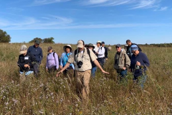 Sam Kieschnick walks ahead of other naturalists in search of local flora and fauna. Photo courtesy of Sam Kieschnick.